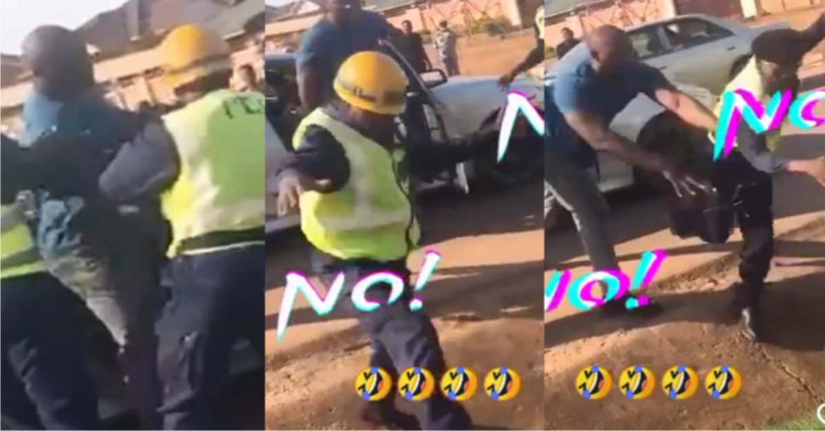 Moment Man Was Begged Not To Beat Three Policemen After They Stopped His Car, Pushes Them Into Gutter(Video)