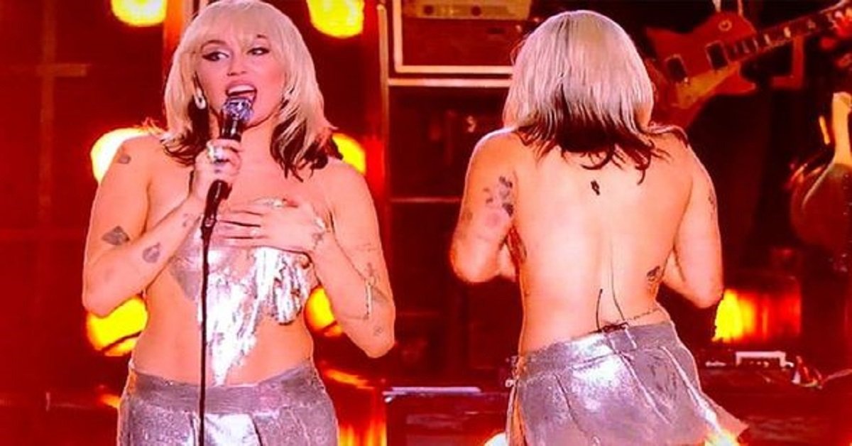 Miley Cyrus suffers wardrobe malfunction as her skimpy top breaks and partly falls off on stage