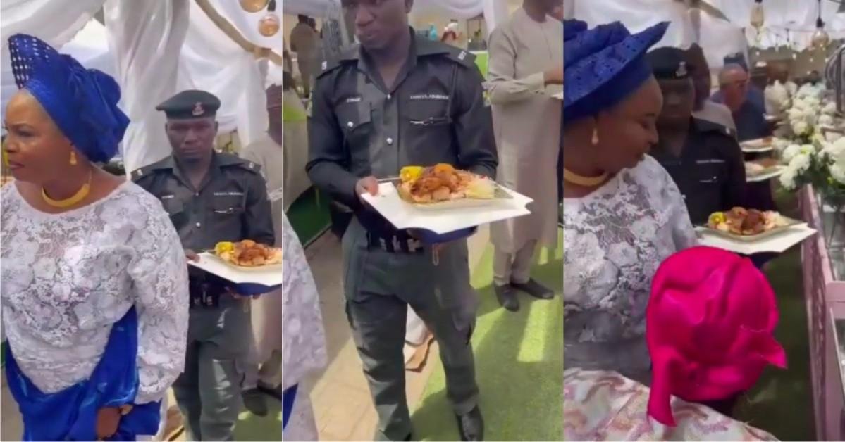 "Even a bouncer shouldn't do this" - Reactions As Police Officer Is Spotted Holding A Plate Of Food For His Madam At A Party