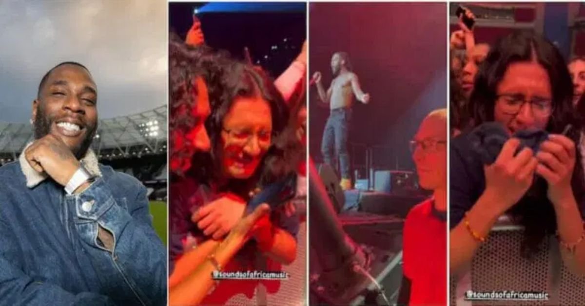 White lady cries a river after catching Burna Boy’s towel during concert (Video)